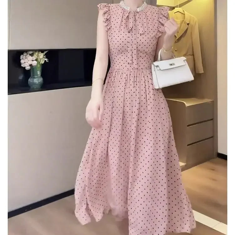 Korean pink polka-dot dress female spring and summer new design sense bubble sleeve fashion temperament waist slim A-line skirt.